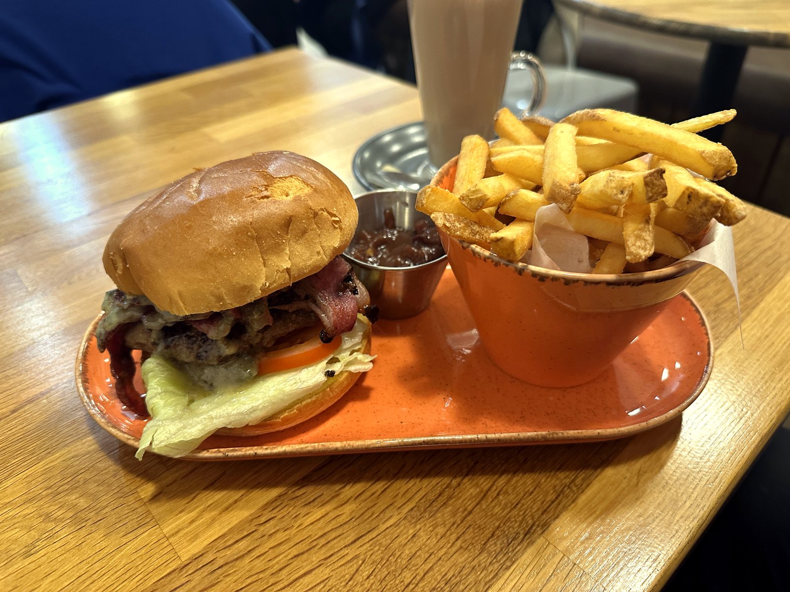 Blue cheese and bacon burger with fries and a milkshake