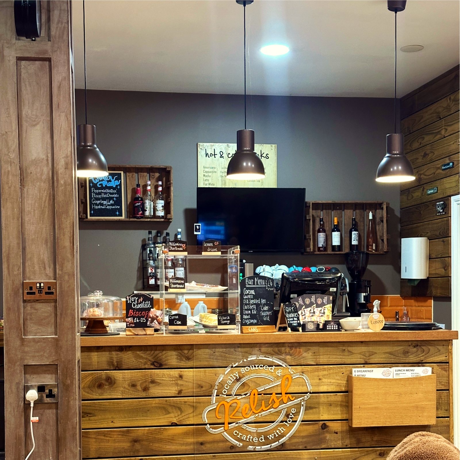 The wooden counter at Relish, proudly marked locally sourced and crafted with love